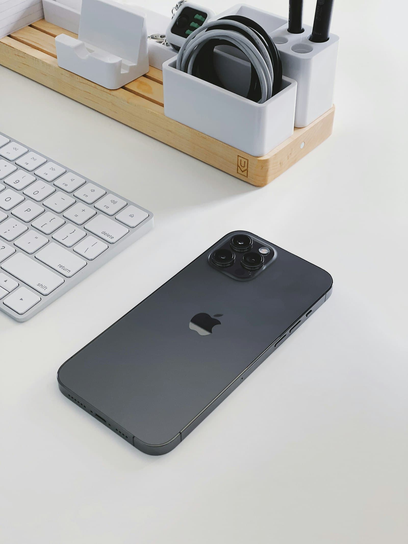 iPhone lying on a white desk
